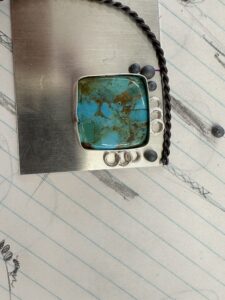 laying out designs for the finished product. using rings and balls